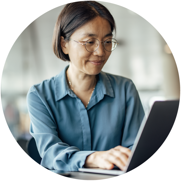 Woman with glasses looking laptop screen