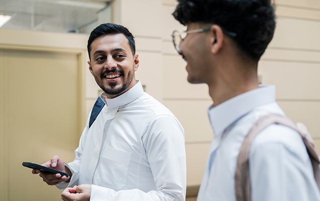 Man and Woman at laptop Smiling